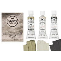 Tri tube HORADAM Naturals akvarel boja iz Trio Air seta, prikazane pored umjetničkog papira.